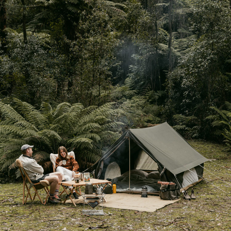 Couple sitting in front of Homecamp A-Frame Tent